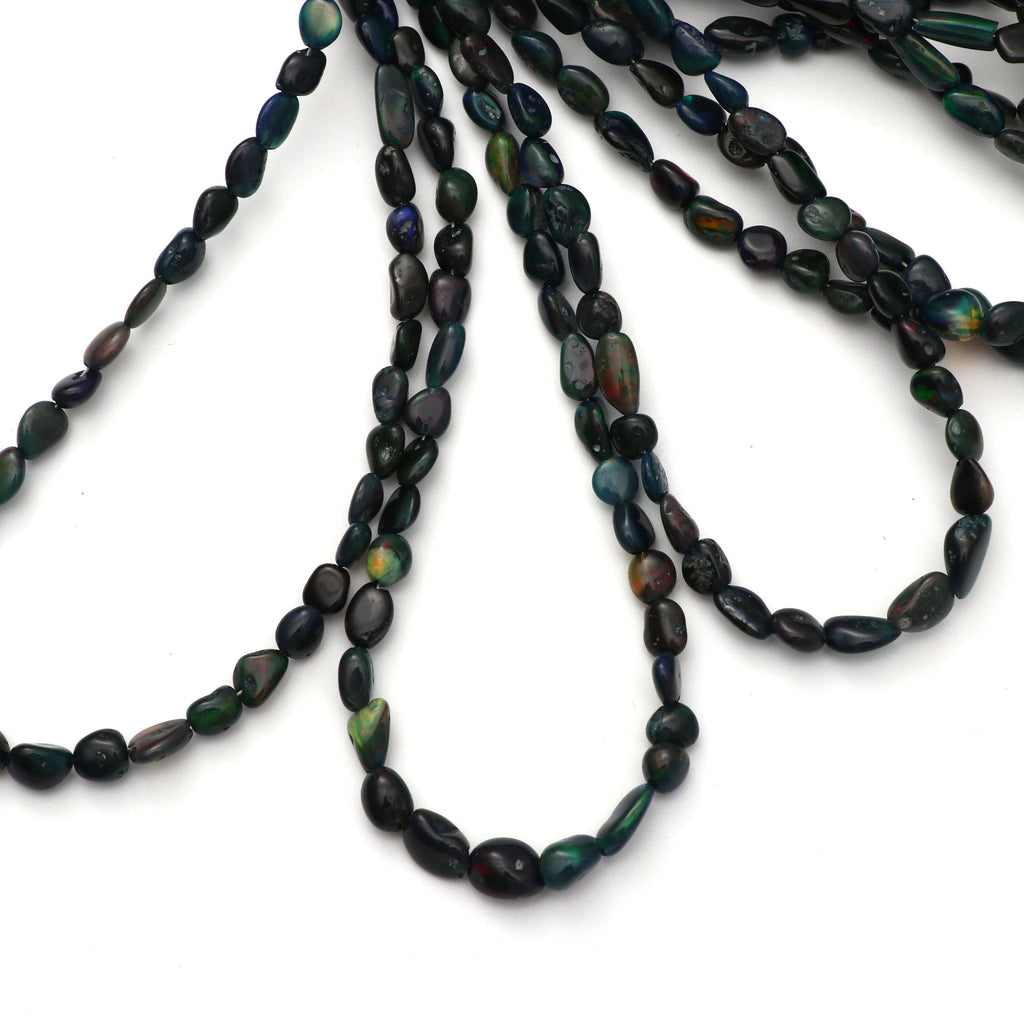 Black Opal Smooth Oval Tumble Beads, 6x3 mm to 7x6 mm Black Opal Tumble- Gem Quality , 8 Inch/ 46 Cm Full Strand, Price Per Strand - National Facets, Gemstone Manufacturer, Natural Gemstones, Gemstone Beads