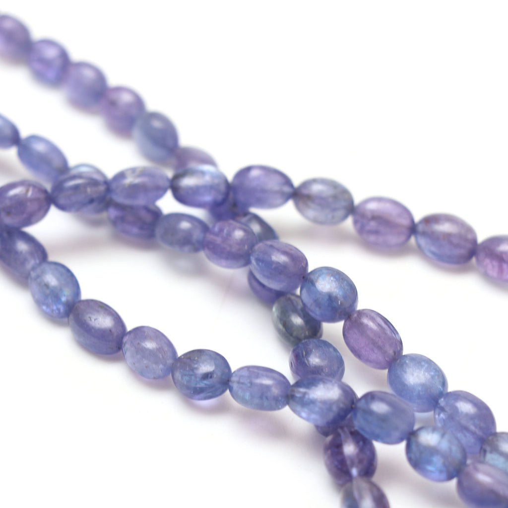 Natural Tanzanite Smooth Tumble Beads | 5x6.5 mm to 9x12 mm | Tanzanite Tumble Gemstone | 8 Inch/ 18 Inch Full Strand | Price Per Strand - National Facets, Gemstone Manufacturer, Natural Gemstones, Gemstone Beads