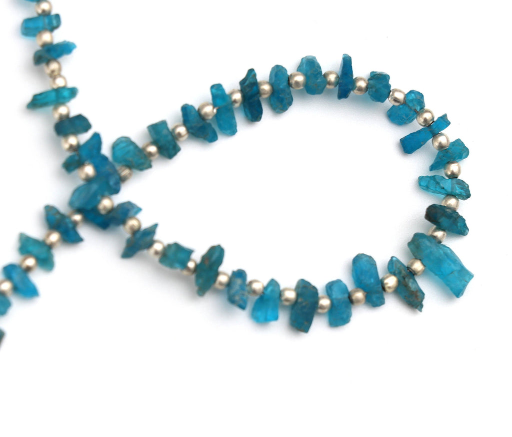 Raw Rough Neon Apatite Rough Beads, Metal Spacer Balls - 3x6 mm to 4x10 mm - Neon Apatite Rough - Gem Quality, 20 Cm, Price Per Strand - National Facets, Gemstone Manufacturer, Natural Gemstones, Gemstone Beads