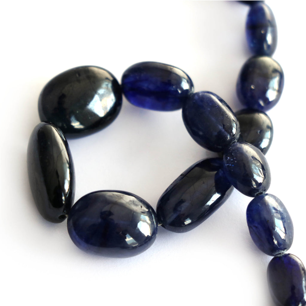 Blue Sapphire Smooth Tumble Glass Filled, Sapphire Tumble- 9x7 mm to 18x13 mm-Blue Sapphire-Gem Quality, 8 Inch Full Strand,Price Per Strand - National Facets, Gemstone Manufacturer, Natural Gemstones, Gemstone Beads