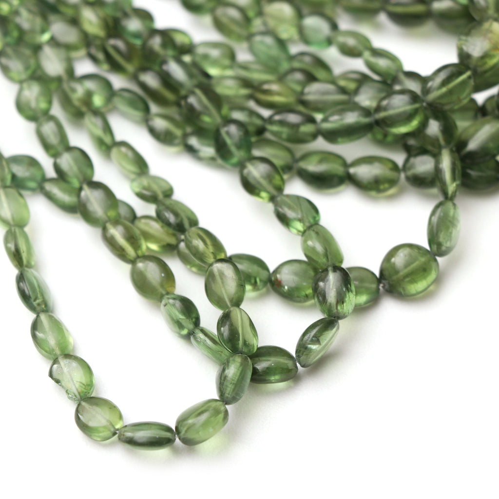 Olive Apatite Smooth Tumble 7x5 to 9x7mm | Natural Olive Apatite Beads For Making Jewelry | Olive Apatite Tumble, 15 Inch Strand, 80 cts - National Facets, Gemstone Manufacturer, Natural Gemstones, Gemstone Beads