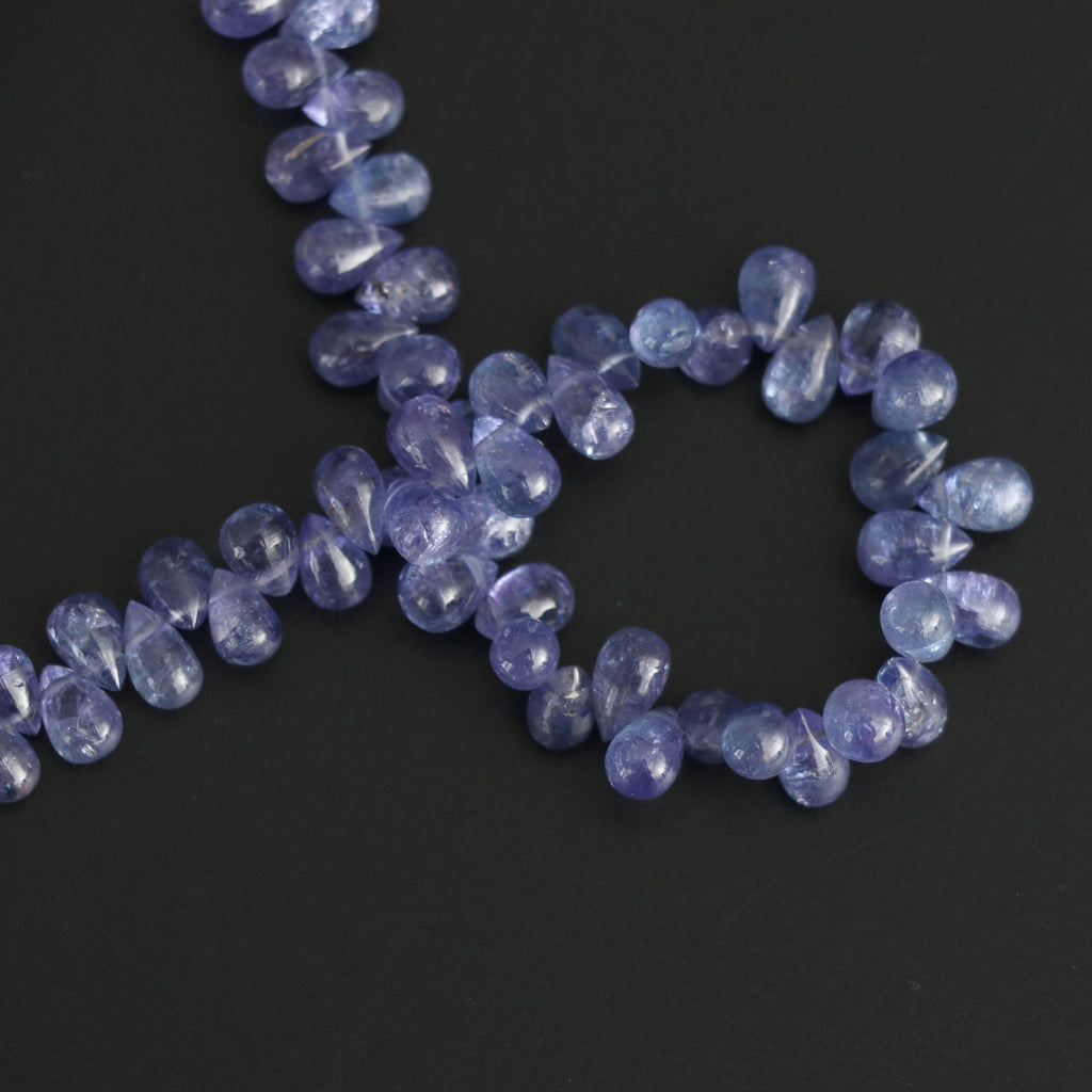 Tanzanite Smooth Drops Beads - 4x6 mm to 5x7 mm - Tanzanite Drops Gemstone- Gem Quality , 8 Inch/ 20 Cm Full Strand, Price Per Strand - National Facets, Gemstone Manufacturer, Natural Gemstones, Gemstone Beads