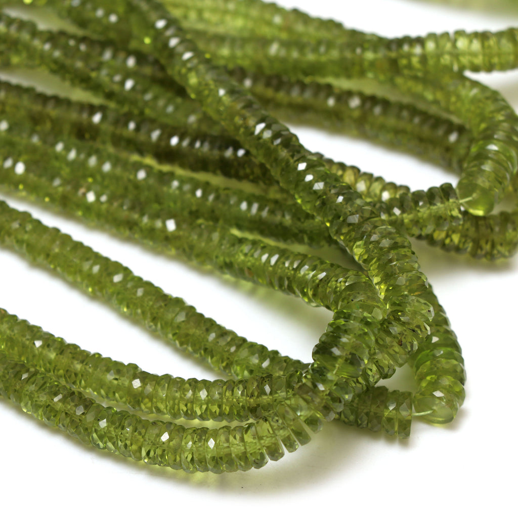 Natural Peridot Faceted Tyre Shape Beads | 4.5 mm to 7 mm | Peridot Wheel Shape Beads | 8 Inch/ 16 Inch Full Strand | Price Per Strand - National Facets, Gemstone Manufacturer, Natural Gemstones, Gemstone Beads